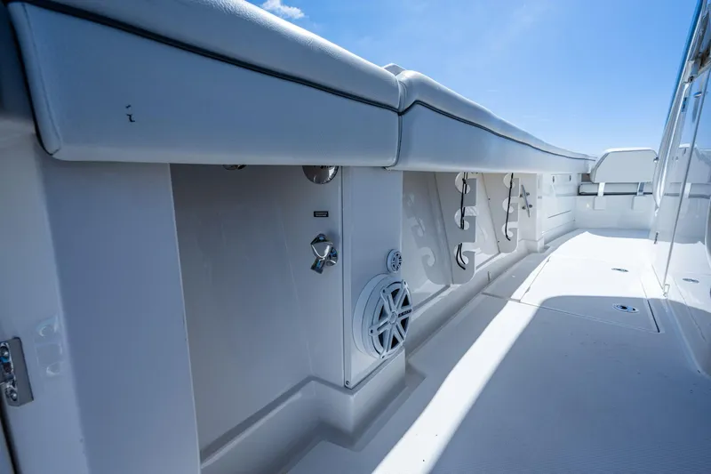  Yacht Photos Pics 2013 Jupiter 34 boat interior with white seating and storage compartments.