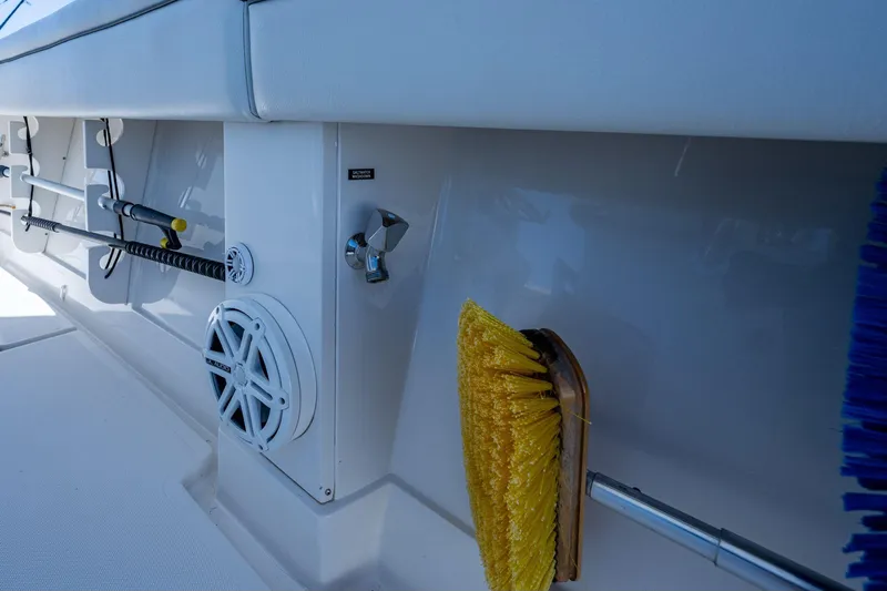  Yacht Photos Pics Interior of a 2013 Jupiter 34 boat with cleaning tools and speaker.