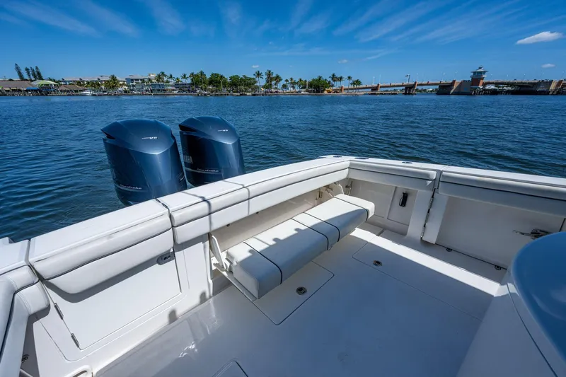  Yacht Photos Pics 2013 Jupiter 34 boat with twin Yamaha engines, docked near a scenic waterfront.