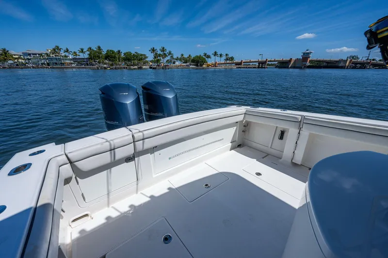  Yacht Photos Pics 2013 Jupiter 34 boat with dual engines on a sunny day, near a coastal area.