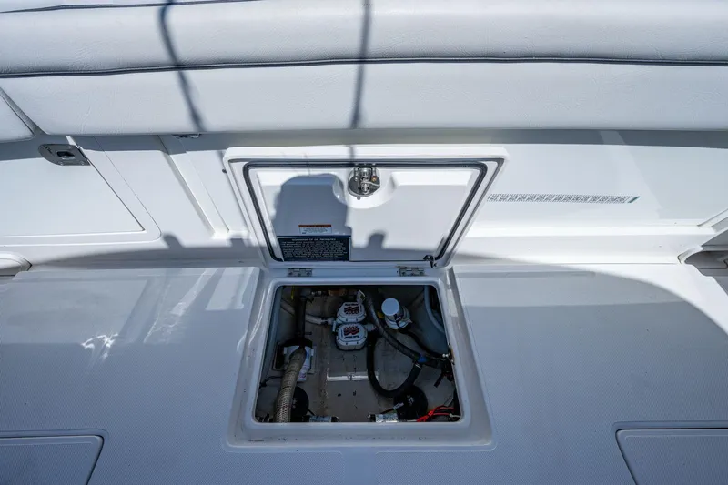  Yacht Photos Pics Open hatch on 2013 Jupiter 34 boat deck, revealing internal components and wiring.