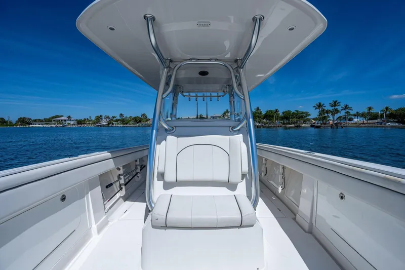  Yacht Photos Pics 2013 Jupiter 34 boat on calm water, clear blue sky, and palm trees in the background.