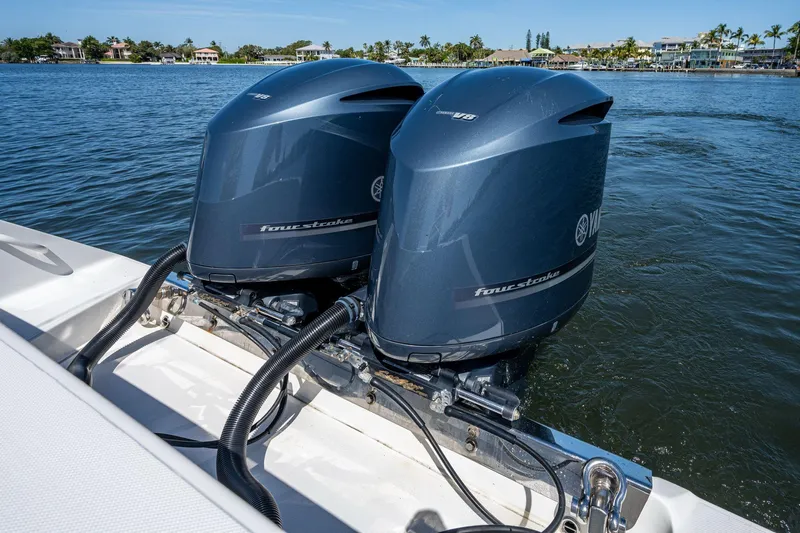  Yacht Photos Pics Twin Yamaha outboard engines on a 2013 Jupiter 34 boat, cruising on a sunny day.