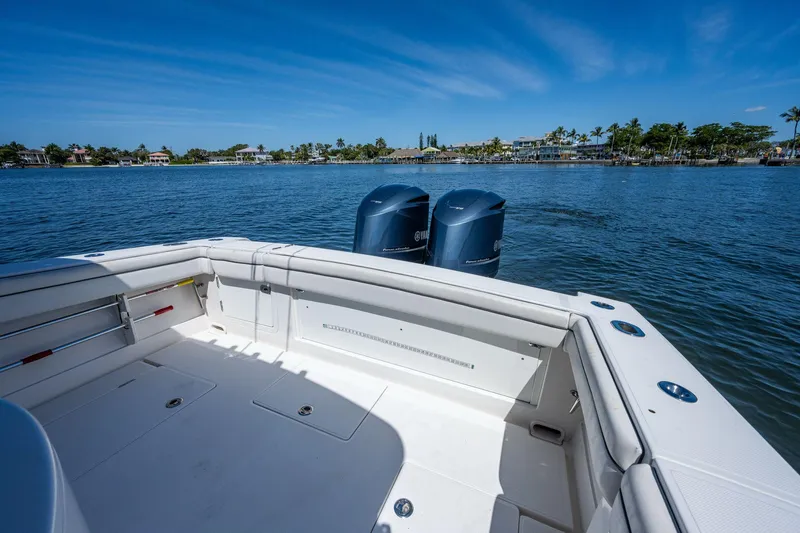  Yacht Photos Pics 2013 Jupiter 34 boat with dual engines on calm water, clear blue sky.