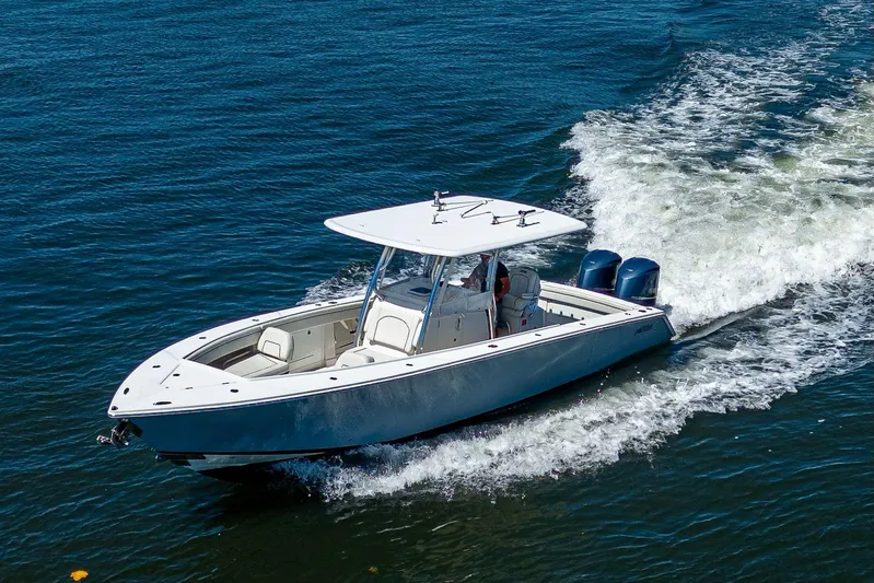  Yacht Photos Pics 2013 Jupiter 34 boat cruising on open water with twin engines.