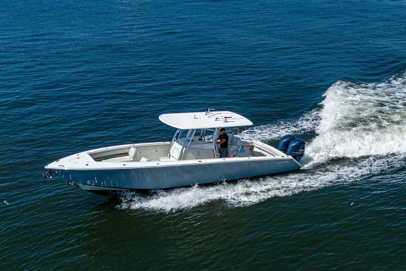  Yacht Photos Pics 2013 Jupiter 34 boat cruising on open water with twin engines.