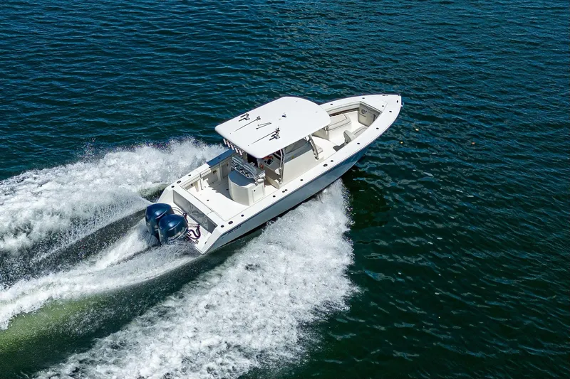  Yacht Photos Pics 2013 Jupiter 34 boat cruising on open water with twin engines.