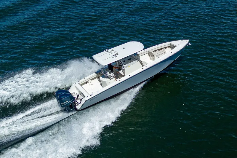  Yacht Photos Pics 2013 Jupiter 34 boat cruising on open water, aerial view.