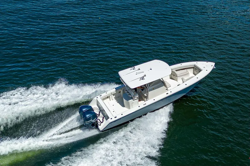  Yacht Photos Pics Aerial view of 2013 Jupiter 34 boat cruising on open water.