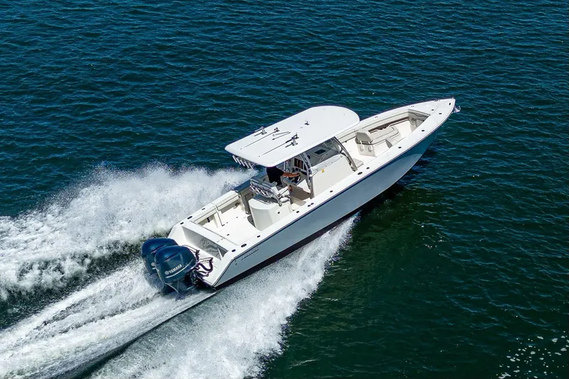  Yacht Photos Pics 2013 Jupiter 34 boat cruising on open water, powered by Yamaha engines.
