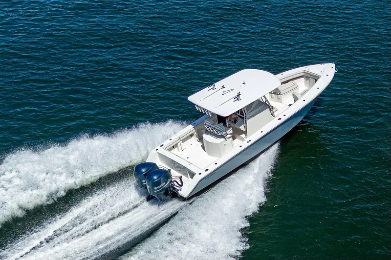  Yacht Photos Pics 2013 Jupiter 34 boat cruising on open water with twin engines.