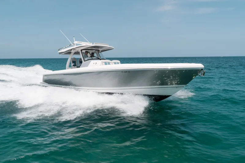  Yacht Photos Pics 2021 Intrepid 407 Nomad SE cruising on open ocean waters.