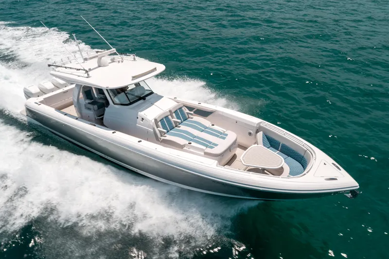  Yacht Photos Pics 2021 Intrepid 407 Nomad SE boat cruising on open water, showcasing sleek design and performance.