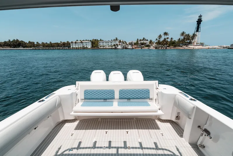  Yacht Photos Pics 2021 Intrepid 407 Nomad SE boat with scenic island and lighthouse view.