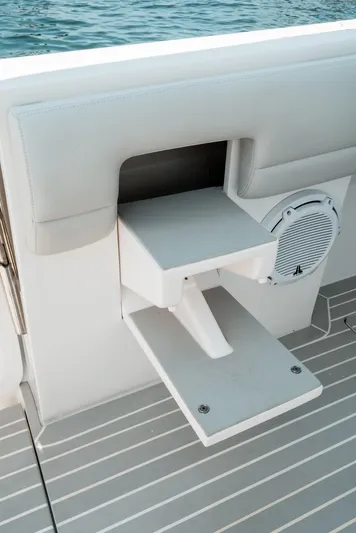  Yacht Photos Pics 2021 Intrepid 407 Nomad SE boat with fold-out step and speaker on deck.