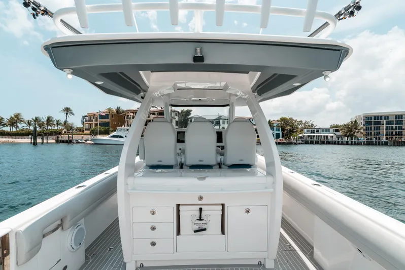  Yacht Photos Pics 2021 Intrepid 407 Nomad SE boat on water, featuring sleek design and modern amenities.