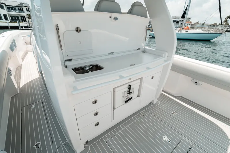  Yacht Photos Pics 2021 Intrepid 407 Nomad SE boat interior with sleek white cabinetry and modern design.