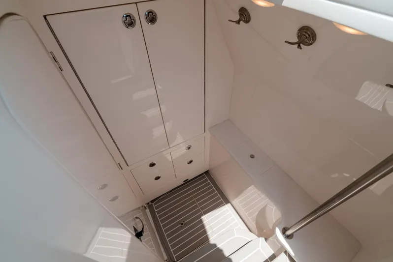  Yacht Photos Pics 2021 Intrepid 407 Nomad SE interior cabin with storage and lighting.