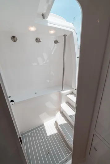  Yacht Photos Pics Interior of 2021 Intrepid 407 Nomad SE boat, featuring sleek white design and modern lighting.