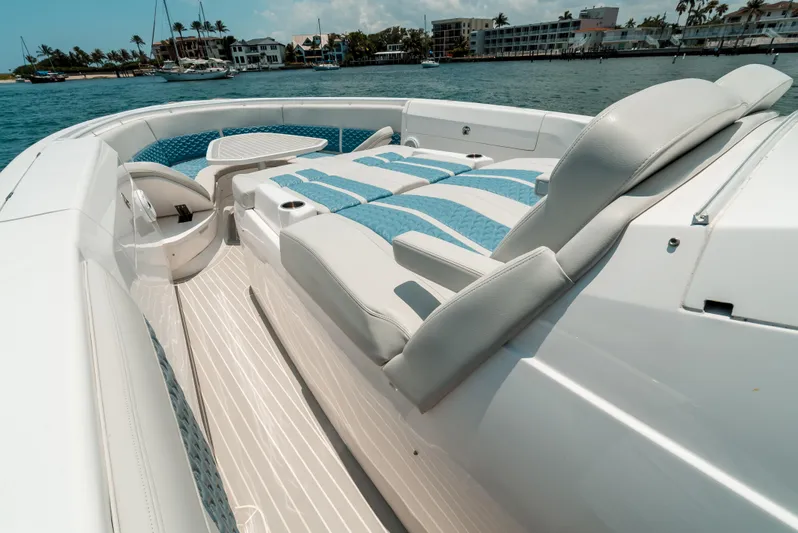  Yacht Photos Pics 2021 Intrepid 407 Nomad SE boat with luxurious seating on a sunny day.