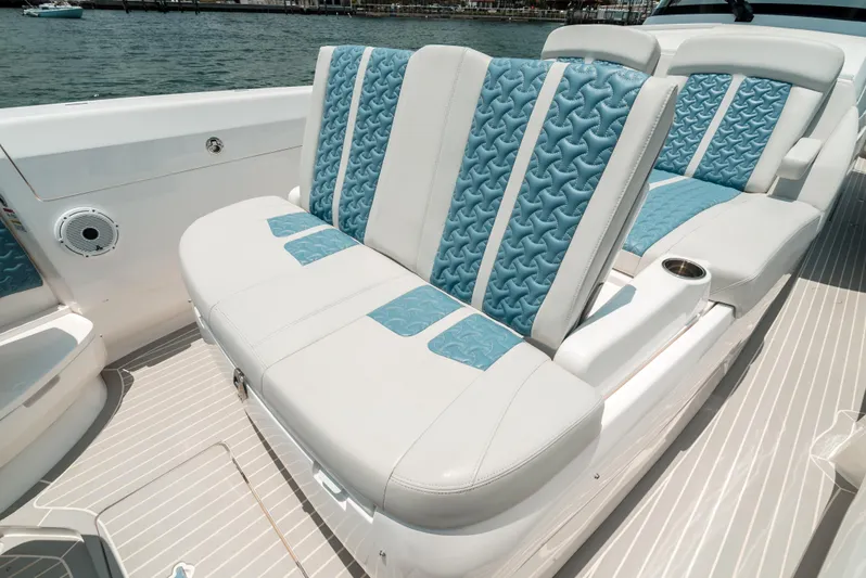  Yacht Photos Pics Luxurious seating on 2021 Intrepid 407 Nomad SE boat with blue and white upholstery.