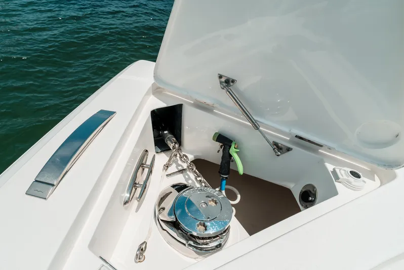 Yacht Photos Pics 2021 Intrepid 407 Nomad SE anchor compartment with open hatch and winch.