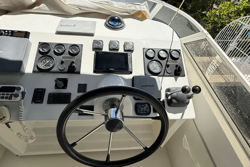 The Motley Crew Yacht Photos Pics Control panel of a 2003 Rival 5700 Navigator boat with Garmin navigation system.