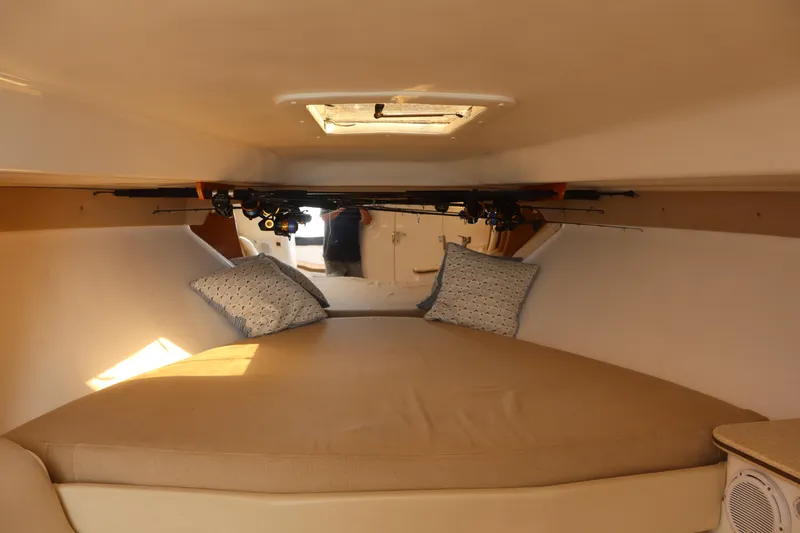 Good Karma Yacht Photos Pics 2006 Intrepid 377 Walk Around cabin interior with cozy bed and pillows.