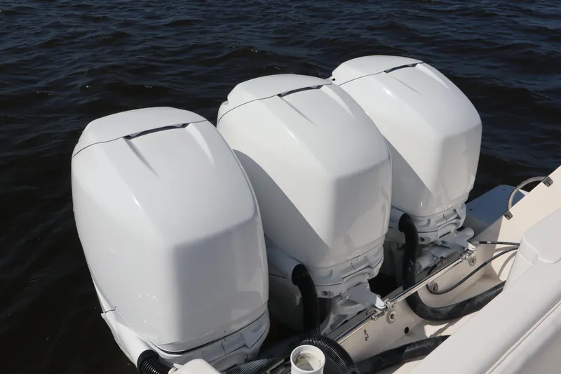 Good Karma Yacht Photos Pics Triple outboard engines on a 2006 Intrepid 377 Walk Around boat.