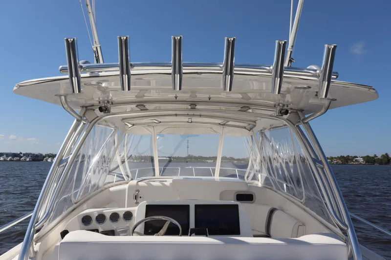 Good Karma Yacht Photos Pics 2006 Intrepid 377 Walk Around boat helm with clear skies and water view.