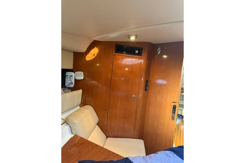 Borabora III Yacht Photos Pics Interior of 2007 Regal Commodore 3760 IB yacht with wood paneling and seating.