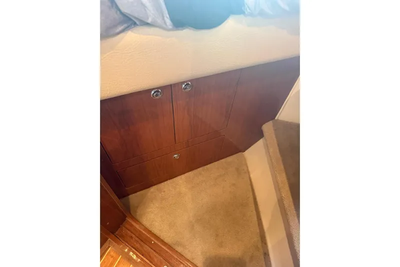 Borabora III Yacht Photos Pics Interior view of 2007 Regal Commodore 3760 IB with wooden cabinetry and carpeted stairs.