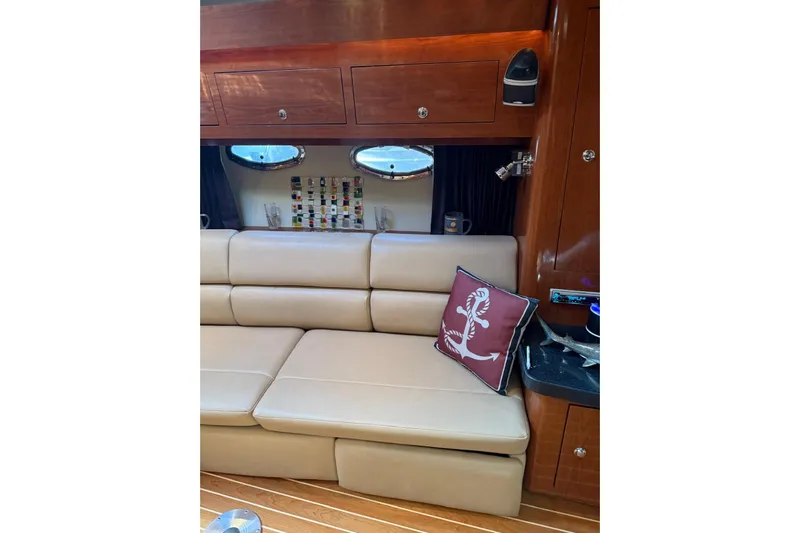 Borabora III Yacht Photos Pics Luxurious interior of 2007 Regal Commodore 3760 IB yacht with beige leather seating.
