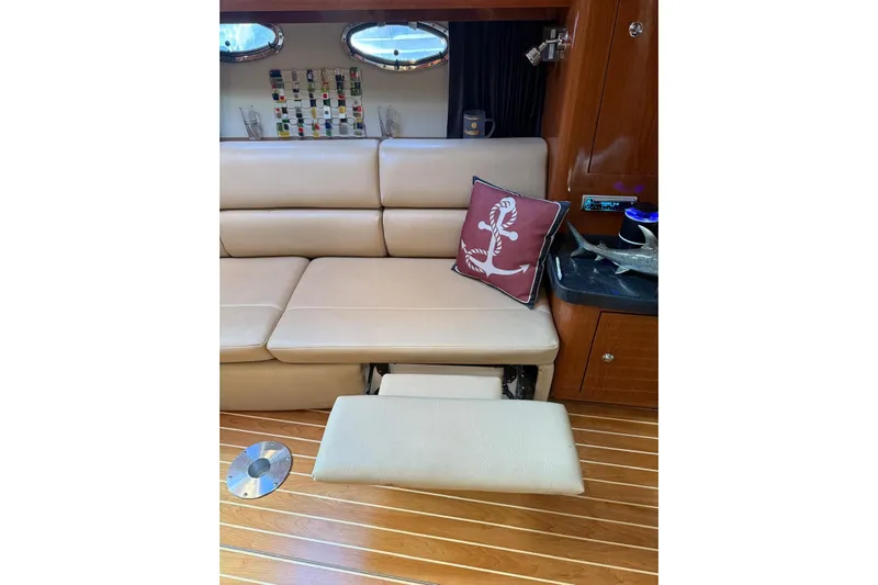 Borabora III Yacht Photos Pics Luxurious interior of 2007 Regal Commodore 3760 IB yacht with beige seating and nautical decor.