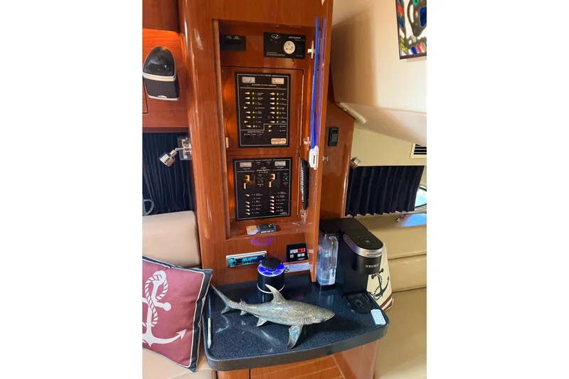 Borabora III Yacht Photos Pics 2007 Regal Commodore 3760 IB interior with control panels, shark decor, and Keurig coffee maker.