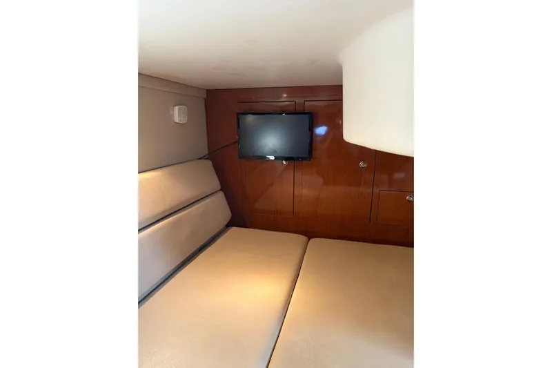 Borabora III Yacht Photos Pics Interior of 2007 Regal Commodore 3760 IB yacht with TV and seating area.