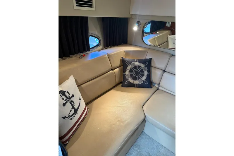 Borabora III Yacht Photos Pics Luxurious interior of 2007 Regal Commodore 3760 IB with nautical-themed cushions.