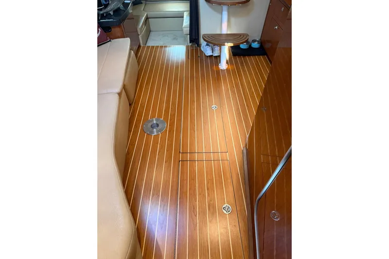 Borabora III Yacht Photos Pics 2007 Regal Commodore 3760 IB interior with polished wooden flooring and seating area.