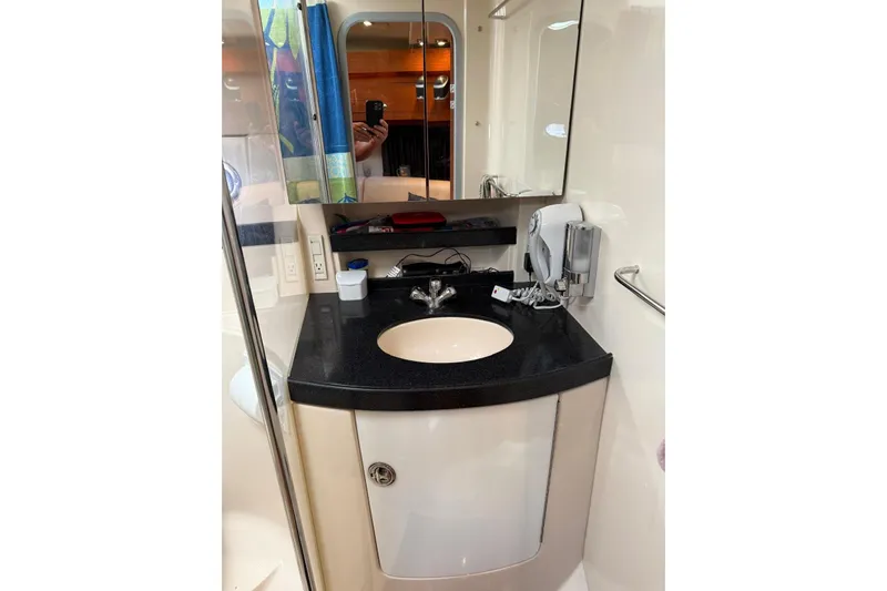 Borabora III Yacht Photos Pics 2007 Regal Commodore 3760 IB bathroom with modern sink and mirror.