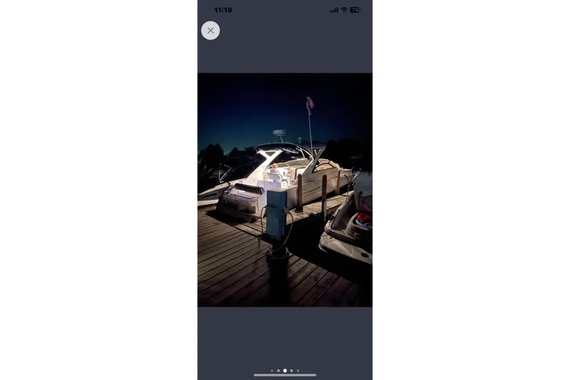 Borabora III Yacht Photos Pics 2007 Regal Commodore 3760 IB yacht docked at night, illuminated with soft lighting.