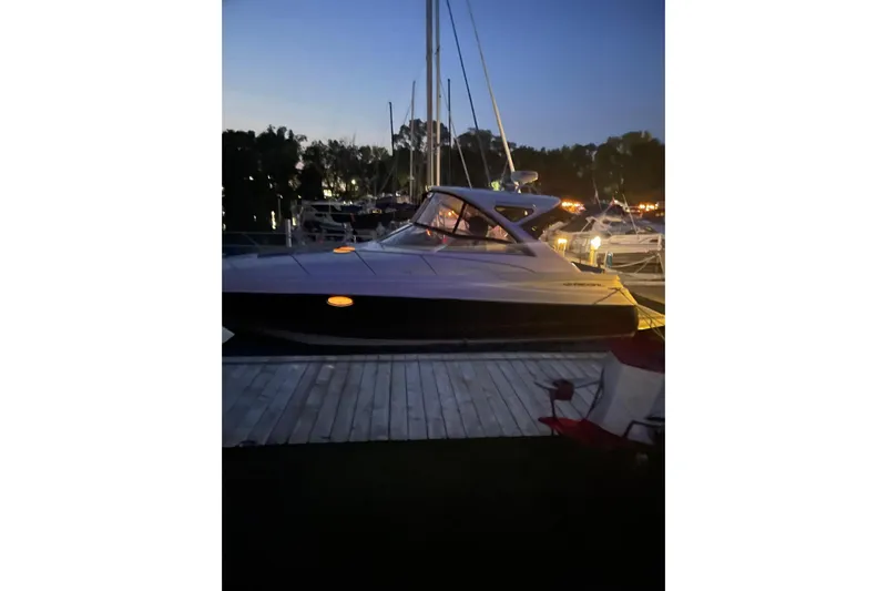 Borabora III Yacht Photos Pics 2007 Regal Commodore 3760 IB yacht docked at twilight, illuminated by soft lights.