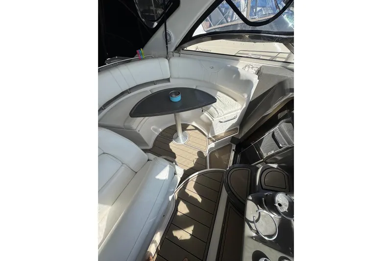 Borabora III Yacht Photos Pics 2007 Regal Commodore 3760 IB yacht interior with white seating and wooden flooring.