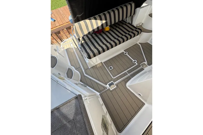 Borabora III Yacht Photos Pics 2007 Regal Commodore 3760 IB boat interior with striped seating and sleek flooring design.