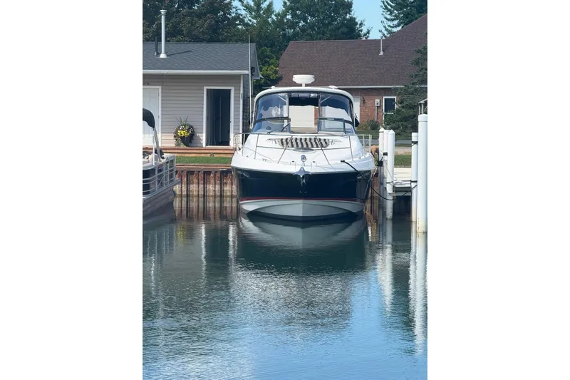 Borabora III Yacht Photos Pics 2007 Regal Commodore 3760 IB yacht docked at a marina, calm water reflection.