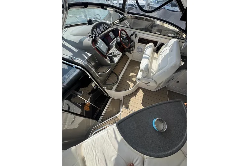 Borabora III Yacht Photos Pics 2007 Regal Commodore 3760 IB boat interior with helm, seating, and dashboard controls.