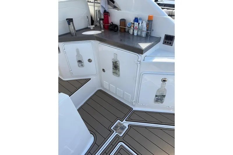 Borabora III Yacht Photos Pics 2007 Regal Commodore 3760 IB boat interior with kitchenette and storage cabinets.