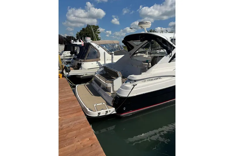 Borabora III Yacht Photos Pics 2007 Regal Commodore 3760 IB yacht docked at marina under blue sky.