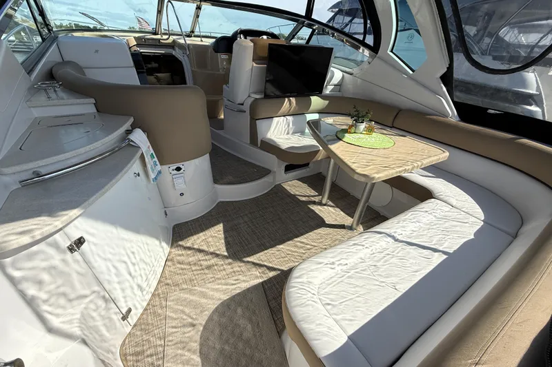  Yacht Photos Pics Luxurious interior of 2013 Four Winns Vista 375 yacht with seating and table.
