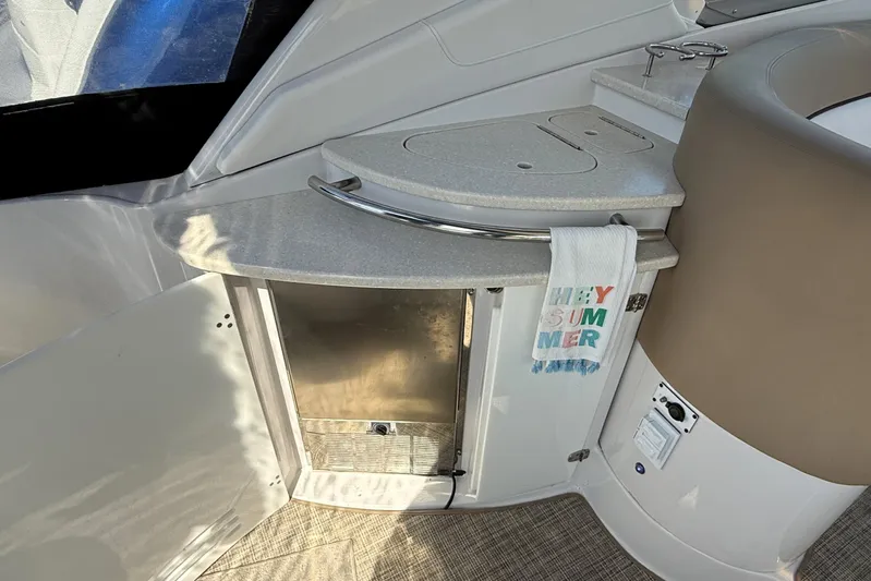  Yacht Photos Pics 2013 Four Winns Vista 375 boat interior with kitchenette and "Hey Summer" towel.