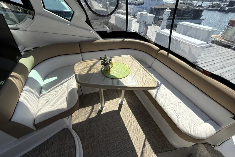  Yacht Photos Pics Luxurious interior of 2013 Four Winns Vista 375 yacht with elegant seating and table.